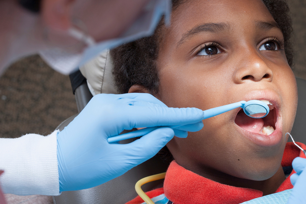 Kids dentist monitoring dental development milestones Stonehaven Dentistry